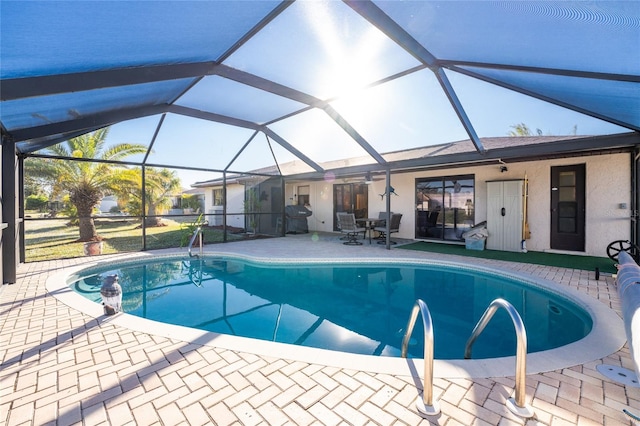 view of pool with a lanai and a patio