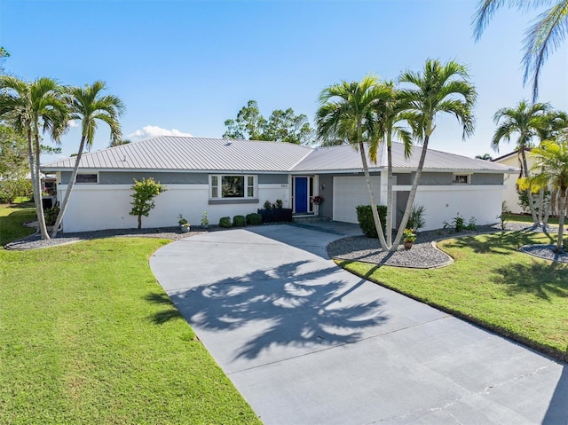 single story home with a front yard and a garage