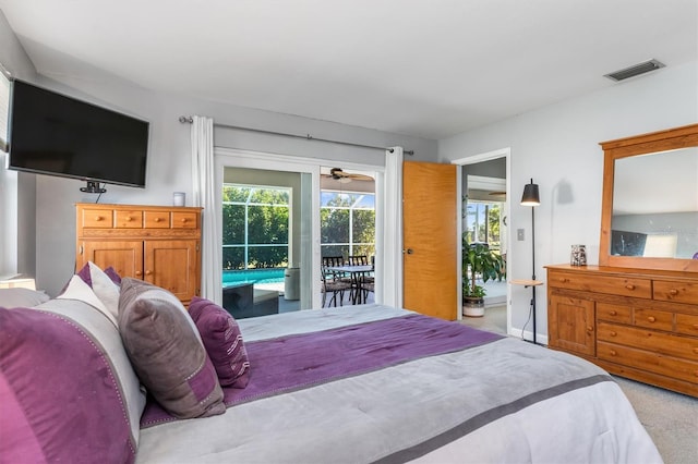 carpeted bedroom featuring access to exterior