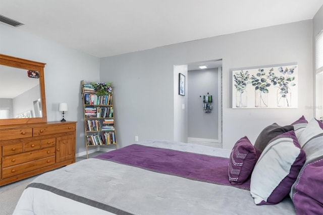 bedroom with light colored carpet