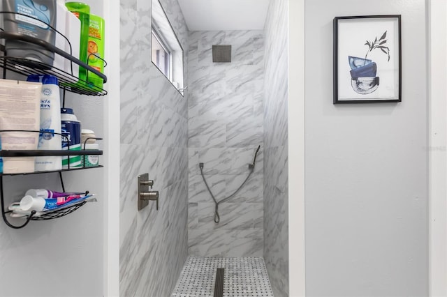 bathroom with a tile shower