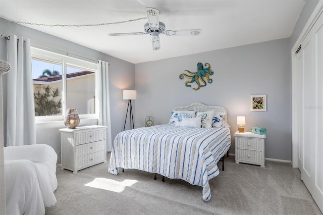 carpeted bedroom with a closet and ceiling fan