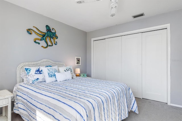 bedroom featuring light carpet and a closet