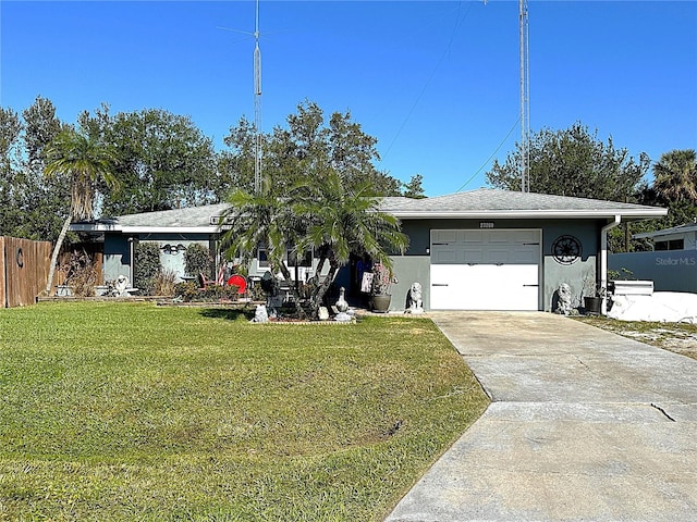 ranch-style home featuring a front yard and a garage