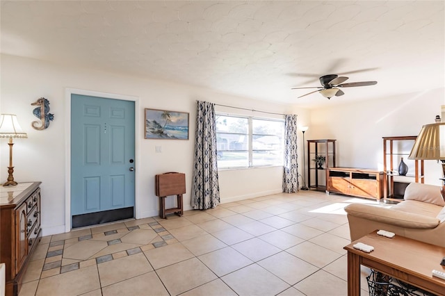 tiled living room featuring ceiling fan