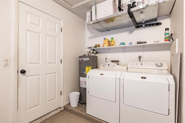 washroom with electric water heater and washing machine and clothes dryer