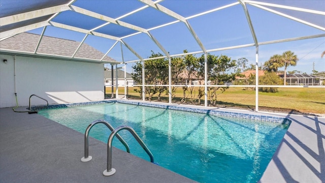 view of pool with glass enclosure