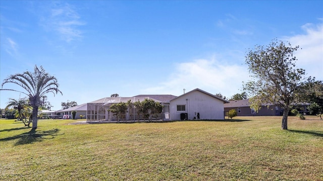 view of yard with glass enclosure