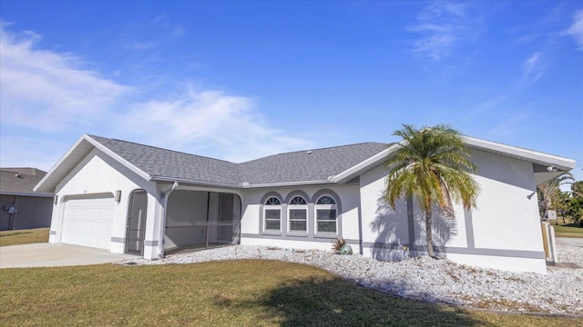 single story home with a garage and a front yard