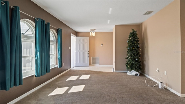 interior space featuring light colored carpet