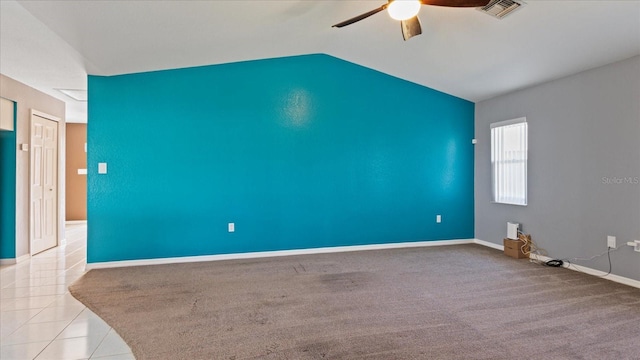 carpeted empty room with ceiling fan and vaulted ceiling