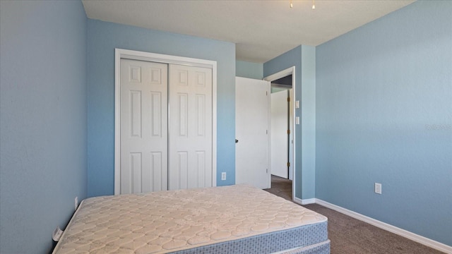 carpeted bedroom with a closet