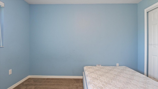 unfurnished bedroom with carpet flooring