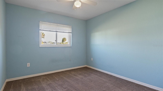 unfurnished room featuring ceiling fan and carpet