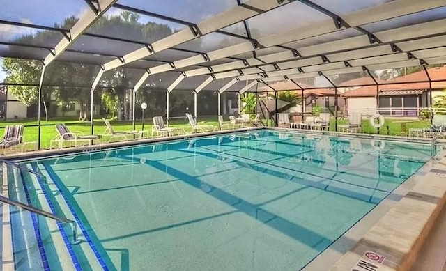 view of swimming pool with glass enclosure