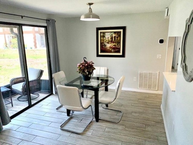 dining room featuring light hardwood / wood-style floors