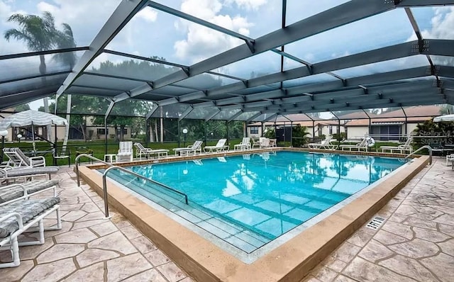 view of pool featuring a lanai and a patio