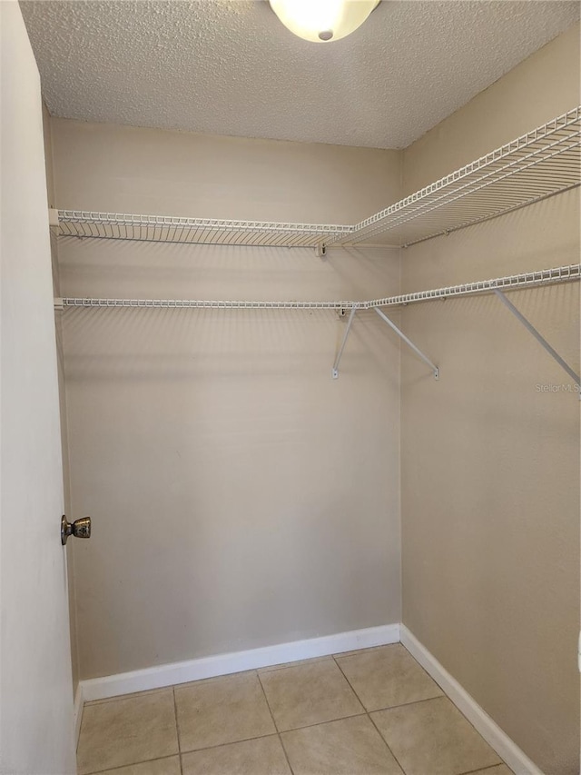 walk in closet featuring tile patterned floors