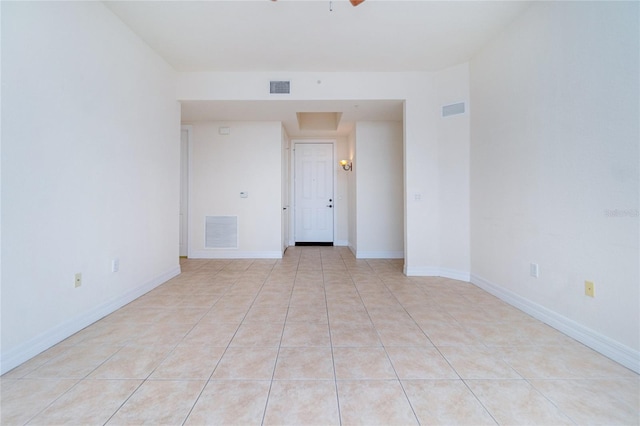 unfurnished room with light tile patterned floors