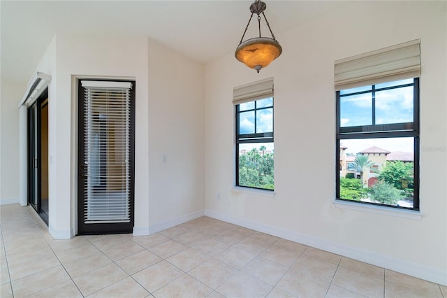 spare room with light tile patterned floors