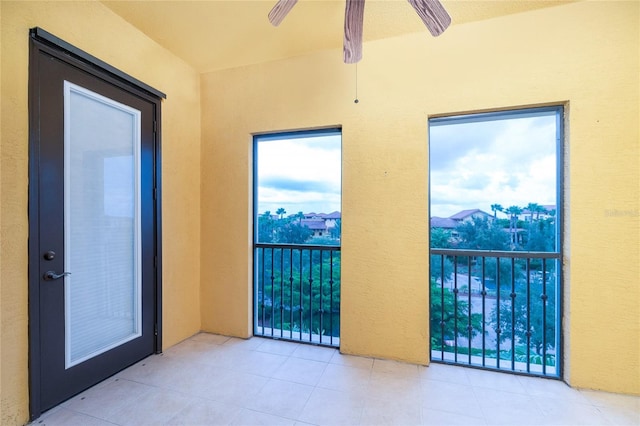 interior space with ceiling fan