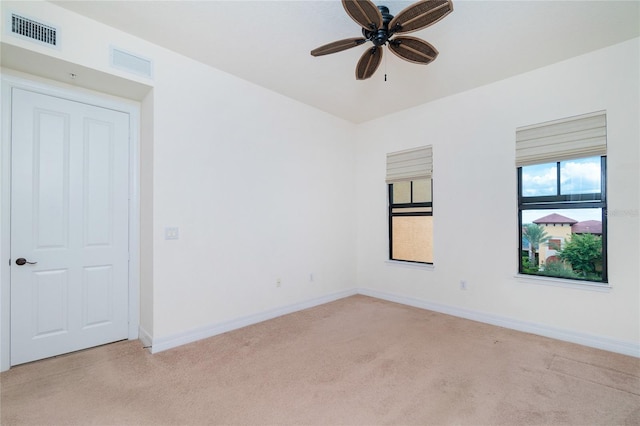 carpeted empty room with ceiling fan