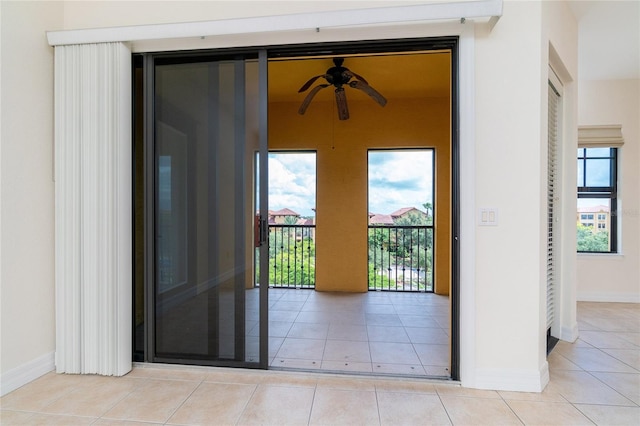 interior space with ceiling fan