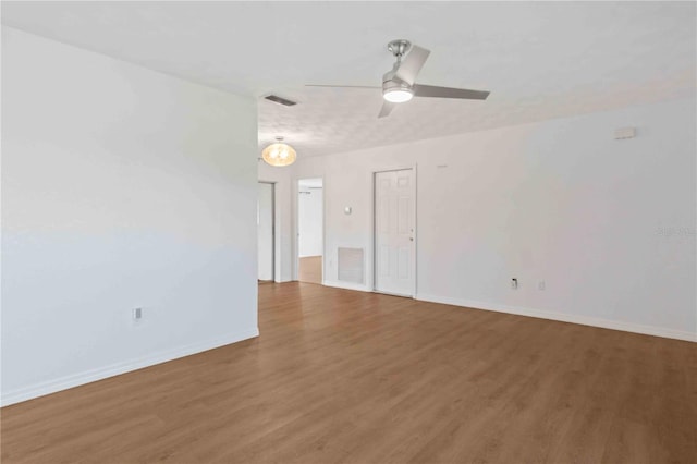 unfurnished room featuring hardwood / wood-style floors and ceiling fan