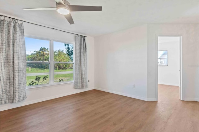 spare room featuring hardwood / wood-style flooring and ceiling fan