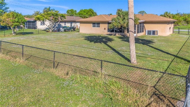 rear view of house with a lawn