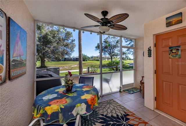 sunroom / solarium with ceiling fan