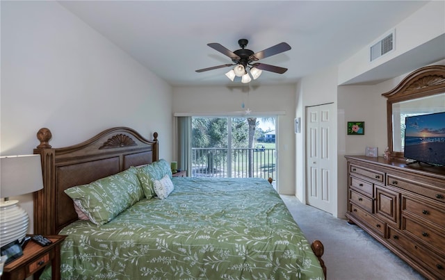 carpeted bedroom with access to outside, ceiling fan, and a closet