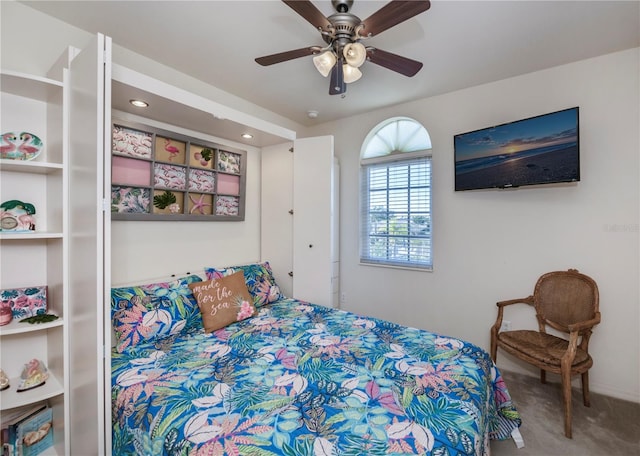 bedroom with ceiling fan and carpet flooring