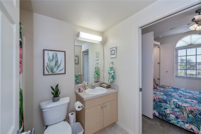 bathroom with ceiling fan, vanity, and toilet