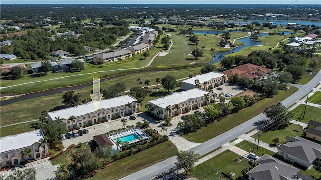 birds eye view of property featuring a water view and a residential view