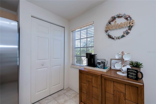 foyer entrance featuring light tile patterned floors