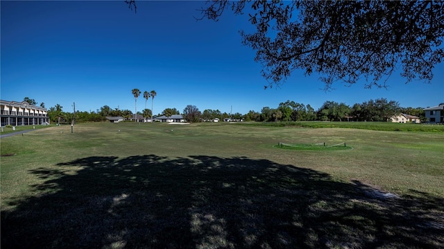 view of home's community with a lawn