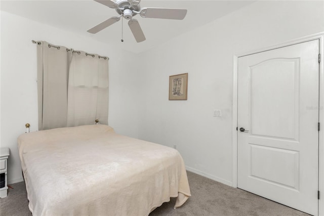 bedroom with ceiling fan and light colored carpet