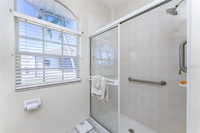 bathroom with a shower with shower door