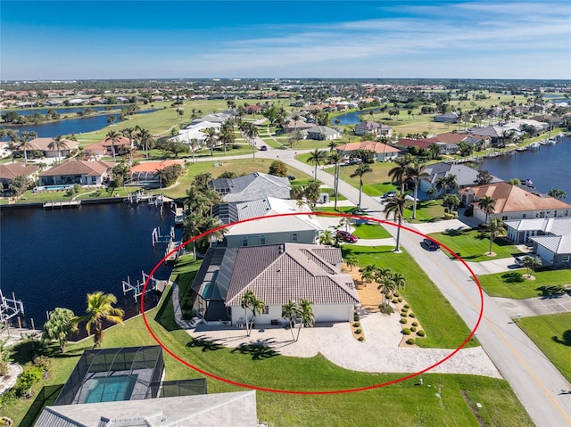 birds eye view of property featuring a water view