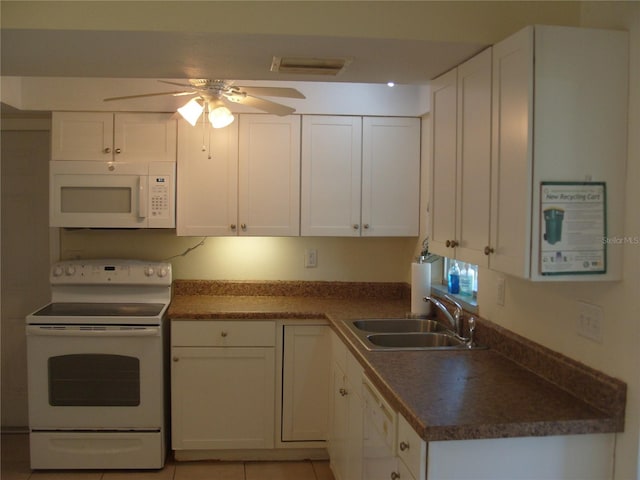 kitchen featuring white cabinetry, white appliances, sink, and light tile patterned floors