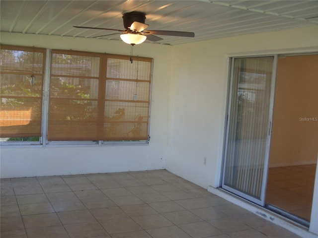 unfurnished sunroom featuring plenty of natural light and ceiling fan