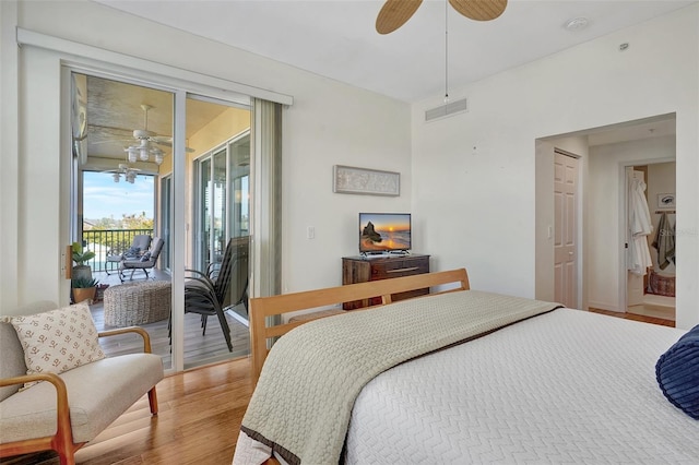 bedroom featuring ceiling fan, access to outside, and light hardwood / wood-style flooring