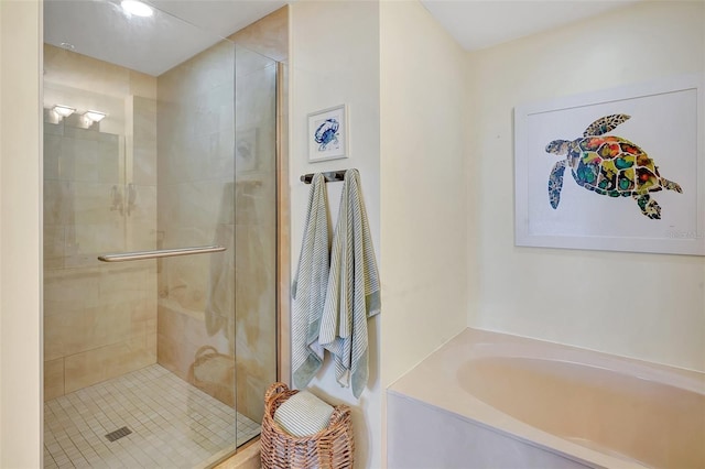 bathroom with shower with separate bathtub