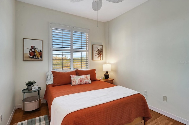 bedroom featuring hardwood / wood-style flooring and ceiling fan