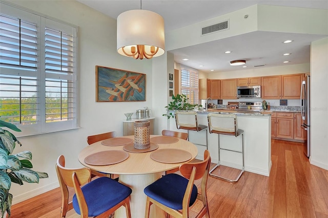 dining area featuring light hardwood / wood-style flooring