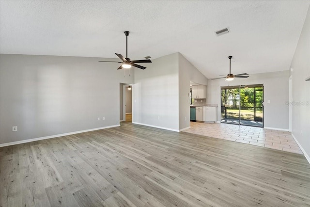 unfurnished living room with ceiling fan, light hardwood / wood-style flooring, high vaulted ceiling, and a textured ceiling