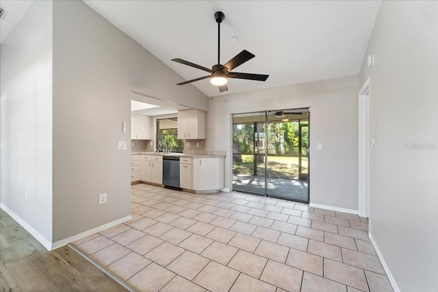 kitchen with tasteful backsplash, ceiling fan, high vaulted ceiling, dishwasher, and white cabinets