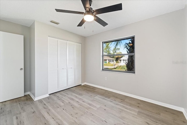 21047 Baffin Ave, Port Charlotte, FL 33954 - unfurnished bedroom featuring light wood-style floors, a closet, and ceiling fan
