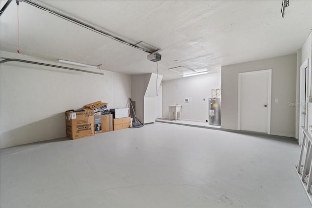 garage featuring electric water heater and a garage door opener